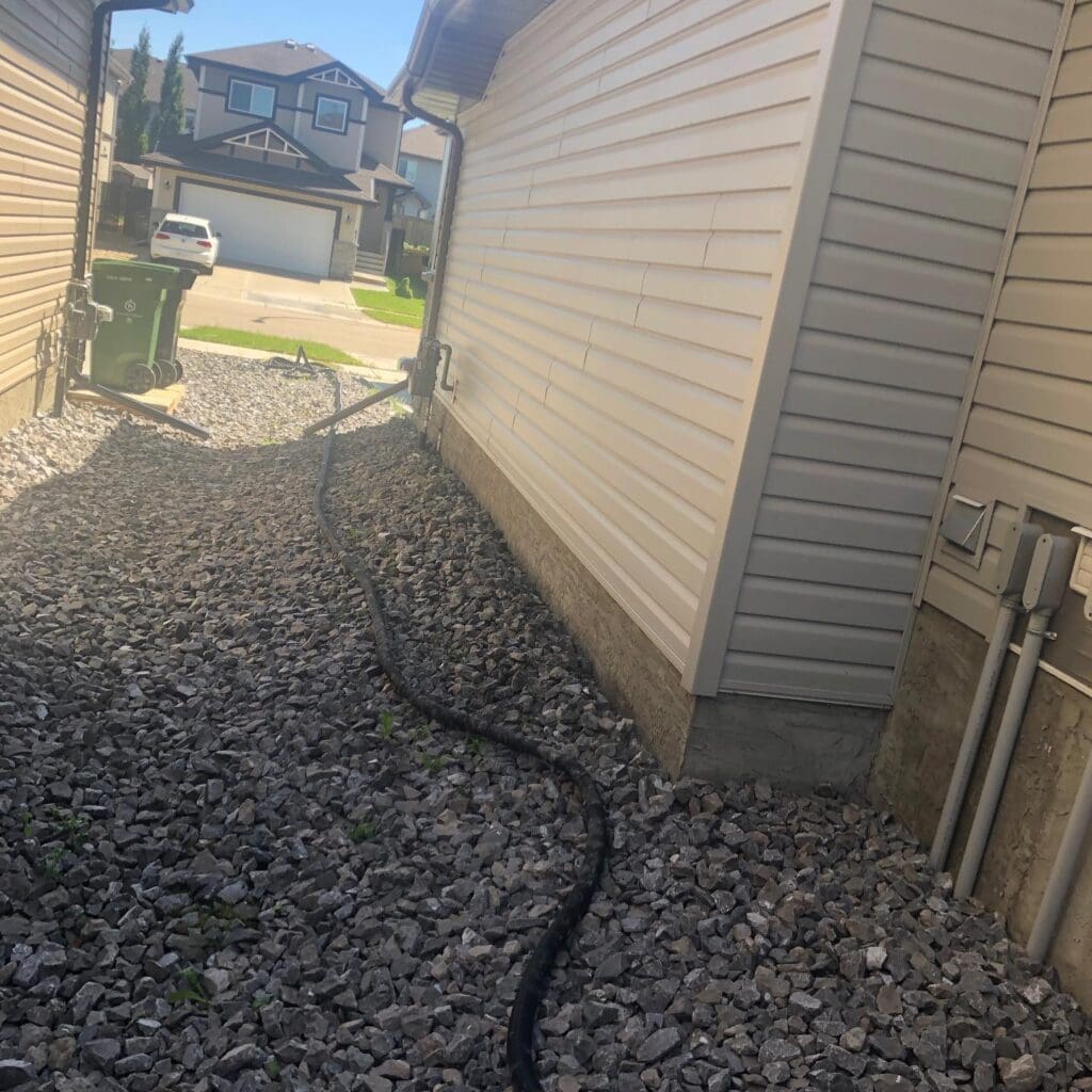Piping a drain pipe of a sump pump into the floor drain of a sanitary sewer in St Albert Piping a drain pipe of a sump punp into the floor drian of a santiary sewer in St Albert